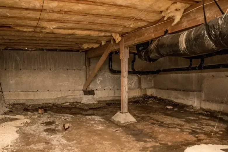 Standing water in a crawl space beneath a raised floor