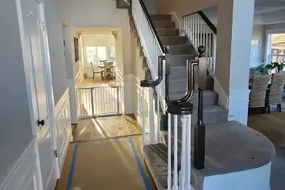 Floor protection and drying equipment set on a townhome staircase